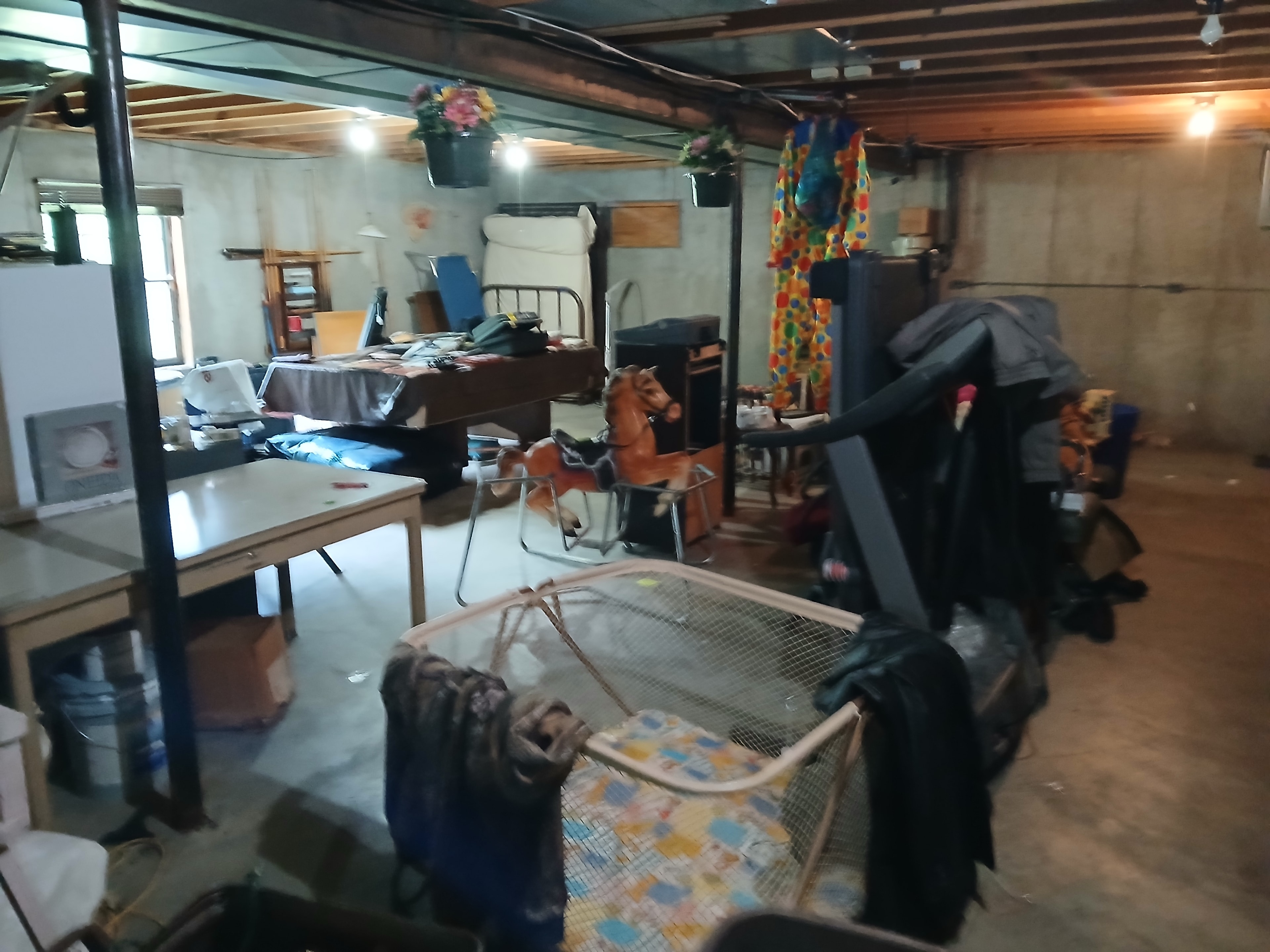 Packed basement full of junk before cleanout — Montgomery City, MO